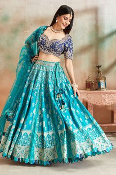 Go for a beautiful traditional look at weddings in this exquisite sea green embroidered Banarasi silk lehenga with blue embroidered blouse. The lehenga comes with a beautiful dupatta. Beautiful Dupatta, Tussar Silk Sarees, Indian Clothing Store, Lehenga Online, Fashion Journals, Tussar Silk Saree, Indian Clothing, Traditional Fabric, Silk Lehenga