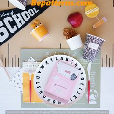 an assortment of school supplies on top of a table with the words back to school