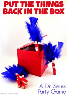 a red box with blue feathers on it and the words put the things back in the box