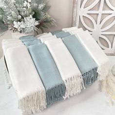 This is a beautiful color combination of ivory and sage pashmina shawls.  Wedding pashminas are a great keepsake gift for your guests or bridesmaids.  What you get: ivory pashmina shawls  sage pashmina shawls 1 Leyla Basket (fits 30 - 50 pashminas) Bows (optional) All products above are linked in case you want to order