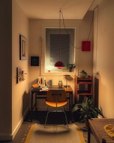 a room with a desk, chair and window in the corner is lit by sunlight coming through the window