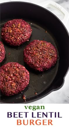 three hamburger patties cooking in a skillet with the title vegan beet lentil burger