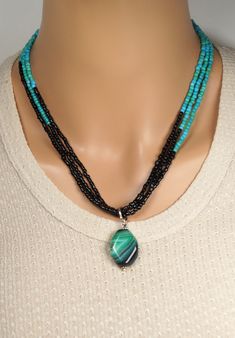 The necklace is made of 30mm green - black agate pendant, and green and black small beads, triple strand. A length is 18'' - 20''(45cm - 50cm). Your jewelry is ready to ship. Thank you for visiting my shop. Black Agate Round Beads Necklace, Black Agate Beaded Necklace, Black Agate Beaded Necklaces, Black Natural Stone Oval Beaded Jewelry, Black Jewelry With Oval Natural Stones, Black Beaded Necklaces With Polished Pendant, Black Beaded Necklace With Polished Pendant, Black Polished Beads Necklace With Pendant, Black Polished Pendant Beaded Necklaces