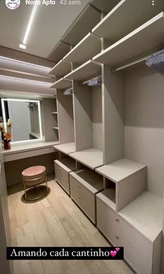 an empty walk in closet with shelves and drawers