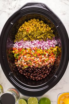 the ingredients in this slow cooker include beans, onions, limes and pineapple slices