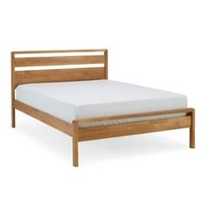 a wooden bed frame with no sheets on it