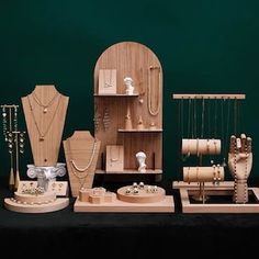 a collection of wooden jewelry and necklaces on display