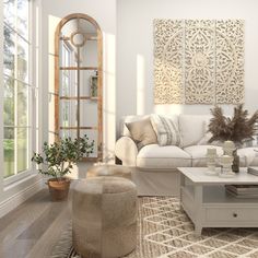 a living room filled with white furniture and lots of windows