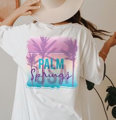 Palm Springs T-Shirt, Coconut Girl Hoodie, Travel Vacation Sweatshirt For Woman, Aesthetic Surf Shirt, Beach outfit, Vacay Mode Gift, E8320 WELCOME TO LITTLE PREPPY TEE.... If you are looking for soft, comfortable, first-class clothes that you can design for your most special days or your loved ones, you are at the right place! We love what we do here at Best Creative Designs and we strive to make your shopping experience just right for you. If you have any questions about our products, feel free to message us anytime. Rest assured that we will do our best for you and reply as soon as possible! 👕H O W  TO  O R D E R 1️⃣ Please, check and review all the photos. 2️⃣ Choose your T-shirt size and color. Different styles of shirts may have different shades of same color choice due to different White Tops For Vacation Loungewear, White Tops For Loungewear On Vacation, White Letter Print Top For Vacation, White Tops With Letter Print For Vacation, Casual Custom Print Tops For Vacation, Casual Tops With Custom Print For Vacation, Leisure T-shirt With Letter Print For Beach Season, White Long Sleeve T-shirt For Beach Season, Shirt Beach Outfit