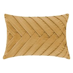 a gold pillow with wavy lines on it