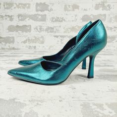 New A D'orsay Styled Pair Of Pumps With A Metallic Sheen Bring An Eye-Catching Look To Your Night-Out Style. 3" Heel Pointed Toe Slip-On Style Synthetic Upper/Rubber Sole Imported Item #7180317 Blue Heels With Pointed Toe Medium Width, Blue Heels With Pointed Toe And Medium Width, Blue Heels With Medium Width And Pointed Toe, Blue Pointed Toe Heels With Medium Width, Blue Pointed Toe Court Shoes With Sculpted Heel, Blue Padded Heel Court Shoes For Party, Blue Court Shoes With Padded Heel For Party, Blue Party Court Shoes With Padded Heel, Blue Kitten Heels With Sculpted Heel And Pointed Toe