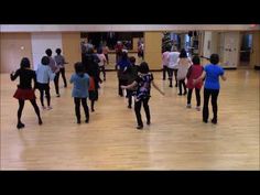 a group of young people dancing in a dance studio