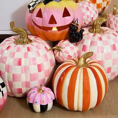 several pumpkins with different designs on them