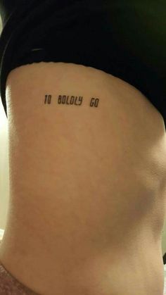 a woman's stomach with the words, no body go written on her side