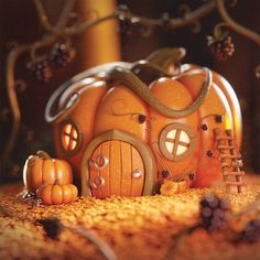 a pumpkin shaped house sitting on top of a table