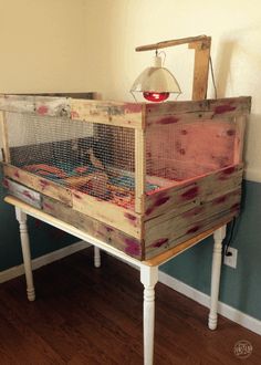 an old crib that has been turned into a table with a lamp on top