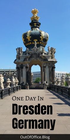 an ornate gate with the words one day in dresden germany