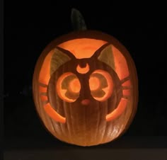 a pumpkin carved to look like a cat