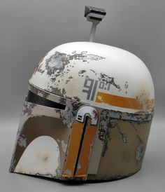 a helmet with the word star wars painted on it's front and side panels