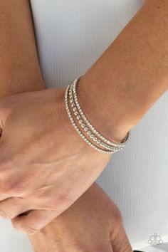 Two strands of dazzling white rhinestones flank a row of shiny silver beads, coalescing into a sparkly layered cuff around the wrist.

 Sold as one individual bracelet. Paparazzi Jewelry Images, Sparkly Fashion, Paparazzi Accessories Jewelry, Candy Bracelet, White Bracelets, Paparazzi Accessories, Blue Gems, White Rhinestone, Chic Jewelry