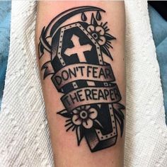 a black and white tattoo with the words don't fear he reaped