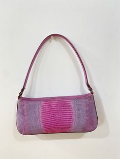 All Reserve items are final sale. Lilac leather embossed baguette. Magnetic closure. Comes with For the Ages dustbag. Condition: EXCELLENT/VERY GOOD Dimensions: Width: 10.6" Height: 4.7" Depth: 2" *** Our scale is based on the following: Excellent Items look visually unused. Very Good Items show minor signs of wear. Good Items show moderate signs of wear. Shoes may show wear such as moderate scuffing at the soles, insoles and heels. Handbags and accessories may show wear such as worn corners, mo Designer Leather Handheld Baguette Bag, Designer Handheld Leather Baguette Bag, Luxury Baguette Bag For Shopping, Elegant Pink Rectangular Baguette Bag, Luxury Textured Leather Baguette Bag, Pink Leather Top Handle Baguette Bag, Luxury Textured Leather Top Handle Baguette Bag, Luxury Soft Leather Baguette Bag, Luxury Soft Leather Rectangular Baguette Bag