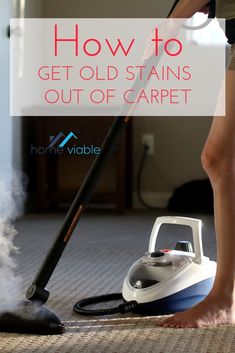 a woman using a steam mop on the floor with text overlay how to get old stains out of carpet