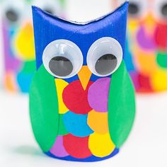 an owl made out of construction paper with googly eyes