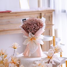 a bouquet of flowers sitting on top of a table