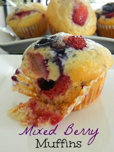 a close up of a muffin on a plate with the words mixed berry muffins