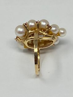 "Vintage Estate 14K Yellow Gold Pearl and Ruby Gemstone Ring. Size 7 Stamped 14K, with other unidentified marks. This ring has been professionally appraised for $2400.00 and that written appraisal will accompany the ring when sold. Since I am not an expert regarding this item, I have relied on the expertise of the certified professional appraisal. The following details about this gold pearl and ruby ring are from a Certified Gemmologist-Certified Goldsmith appraisal: \"One ladies yellow gold -pe Classic White Multi-stone Cluster Ring, Yellow Gold Multi-stone Round Pearl Ring, Yellow Gold Multi-stone Pearl Ring, Vintage High Quality Jewelry For Formal Occasions, Anniversary Yellow Gold Multi-stone Pearl Ring, Formal White Multi-stone Pearl Ring, Formal Multi-stone Pearl Ring In Fine Jewelry Style, Formal Yellow Gold Multi-stone Pearl Ring, Elegant Cluster Jewelry For Collectors