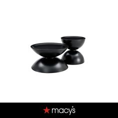 two black bowls sitting next to each other on top of a white surface with the words macy's above them