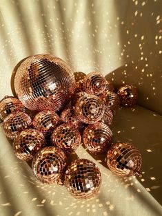 many shiny disco balls sitting on top of a table