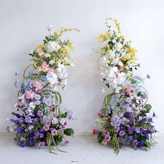 two floral arrangements are arranged next to each other