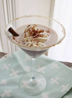 a drink with ice cream and cinnamon on the rim