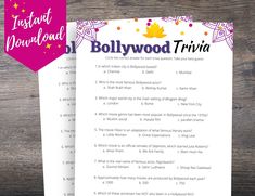 the hollywood trivia game is shown on top of a wooden table