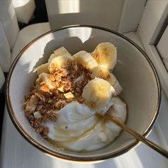 a bowl filled with yogurt and banana slices