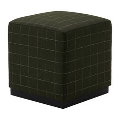 a green square ottoman with black trim on the top and bottom, sitting in front of a white background