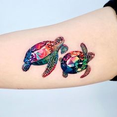 two colorful sea turtle tattoos on the arm