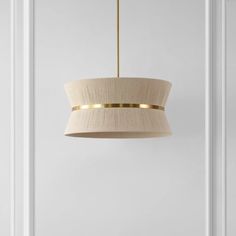 a light fixture hanging from the ceiling in a room with white walls and flooring