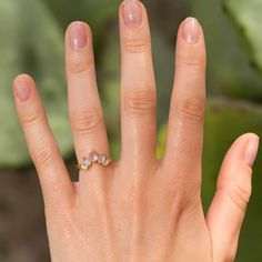 Five rose cut pear shaped moonstones arranged in a half moon layout. Moonstones are known for their soft blue iridescence. While the ancient Greeks saw them as a symbol of passion, love, and clairvoyance, we just think they look beautiful. This ring sits great by itself or can be stacked with a solitaire. 14k gold. Middle moonstone = 5x3mm. Each piece is made to order. Please allow 2-3 weeks to make. Teardrop Moonstone Jewelry With Rose Cut Diamonds, Wedding Moonstone Ring, Wedding Moonstone Ring With Natural Stones, Pear-shaped Moonstone Ring As Gift, Marquise Cut Moonstone Ring Gift, Fine Jewelry Moonstone Pear-shaped Ring Gift, Pear-shaped Moonstone Ring For Gift, Fine Jewelry Gift Moonstone Pear-shaped Ring, Fine Jewelry Gift: Pear-shaped Moonstone Ring