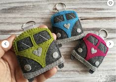 three keychains made out of felt with different colors and designs on each one