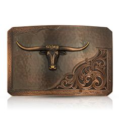 Rough Out with Team Roper Belt Buckle -Made in the USA! Please allow 10-14 days to ship Inspired by the traditional look of a Rough Out saddle, this vintage bronze finished rectangular buckle has an overall rectangular shape with just the tips of the corners cut. A lightly hammered surface, like rippled suede, contrasts next to the deeply engraved classic leather style along the bottom corner. An edge of lightly engraved scroll work frames the overall design with a line that runs along the borde Western Antique Belt Buckles In Rectangular Shape, Western Antique Rectangular Belt Buckle, Western Style Rectangular Antique Belt Buckle, Vintage Rectangular Engraved Belt Buckles, Rectangular Antique Brown Belt Buckles, Vintage Engraved Rectangular Belt Buckles, Vintage Engraved Brown Belt Buckles, Vintage Brown Engraved Belt Buckles, Western Candle Holders