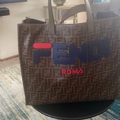 Fendi Tote Bag. Designer Bags With Logo For Errands, Rectangular Travel Shoulder Bag With Designer Logo, Designer Shoulder Bag With Logo For Travel, Rectangular Shoulder Bag With Designer Logo For Travel, Designer Rectangular Bag With Logo, Designer Rectangular Bags With Logo, Rectangular Designer Shoulder Bag For Travel, Designer Logo Rectangular Shoulder Bag For Travel, Designer Brown Bag With Logo