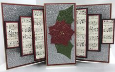 an open card with music notes and a poinsetti