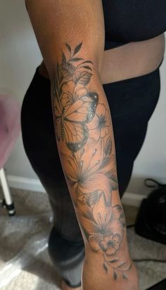 a woman with a tattoo on her arm