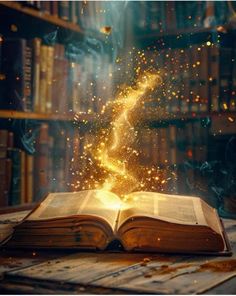 an open book on top of a wooden table in front of a bookshelf