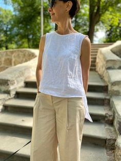 Want to feel comfortable on a hot day? Choose linen clothes! CARE FOR LINEN - Machine wash up to 30ºC/86ºF gentle cycle - Lay flat to dry or tumble dry low - Warm iron if needed - Do not bleach ON THE PHOTO:  Height of model - 161 cm  Model wearing size XS/S.  Best for waists: 26 - 27 inch (66-69 cm). Best for hips: 36 -3 7 inch (91-94 cm). Length: front of 19 inch (48 cm) / back 26 inch (65 cm) Color of top - PEARL WHITE SIZE CHART: * Please note that all garment measurements are approximate as Summer Sleeveless Relaxed Fit Tank Top, White Relaxed Fit Tank Top For Beach, Summer Sleeveless Tops For Everyday, Summer Sleeveless Everyday Tops, Everyday Summer Sleeveless Tops, Relaxed Sleeveless Top For Beach, Relaxed Sleeveless Tank Top For Spring, Casual Linen Tank Top For Daywear, White Sleeveless Linen Top