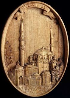 a wooden plaque with an image of a mosque