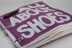 a purple book with all about shoes written on it